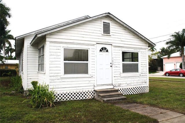 bungalow with a front lawn