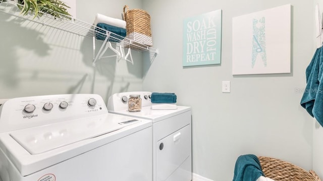 washroom featuring washing machine and dryer