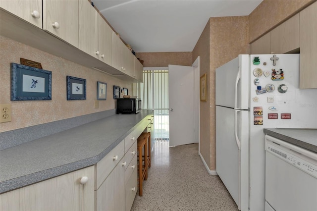 kitchen featuring light brown cabinets and dishwasher