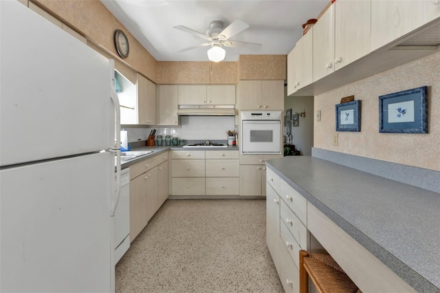 kitchen featuring white appliances and ceiling fan