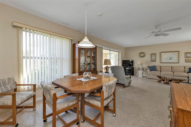 dining space with ceiling fan