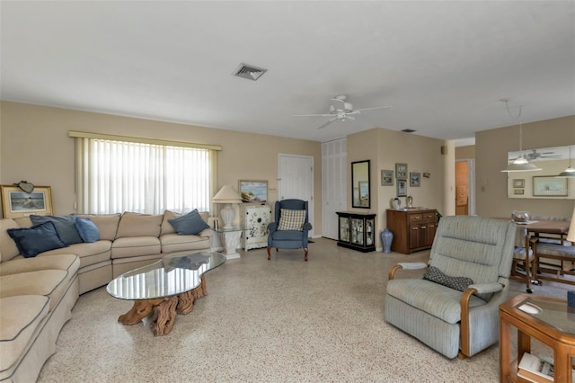 living room featuring ceiling fan