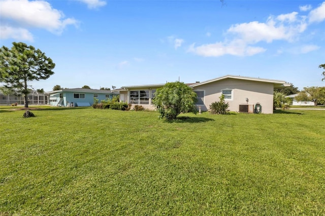 view of yard featuring a lanai