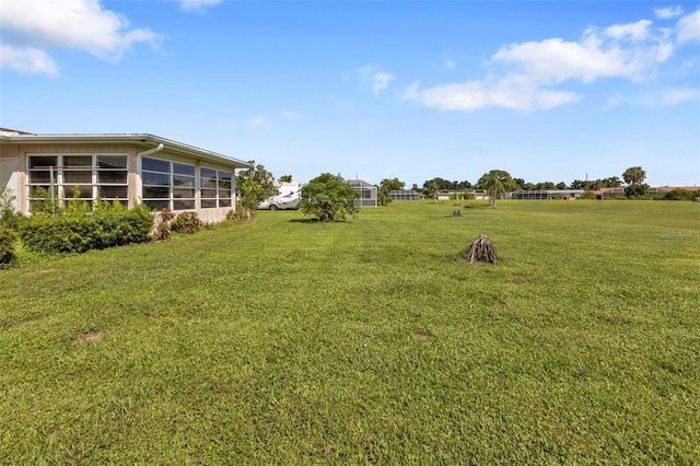 view of yard featuring a sunroom