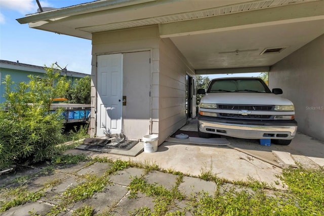 exterior space featuring a carport