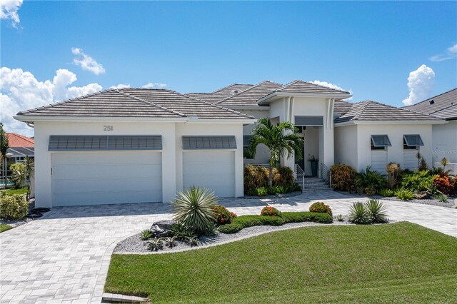 view of front facade with a garage and a front yard