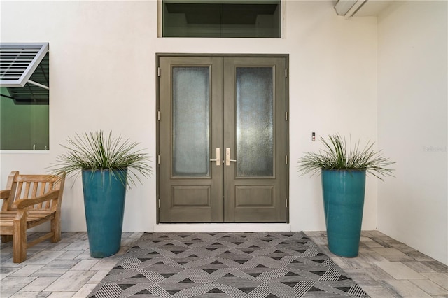 property entrance featuring french doors