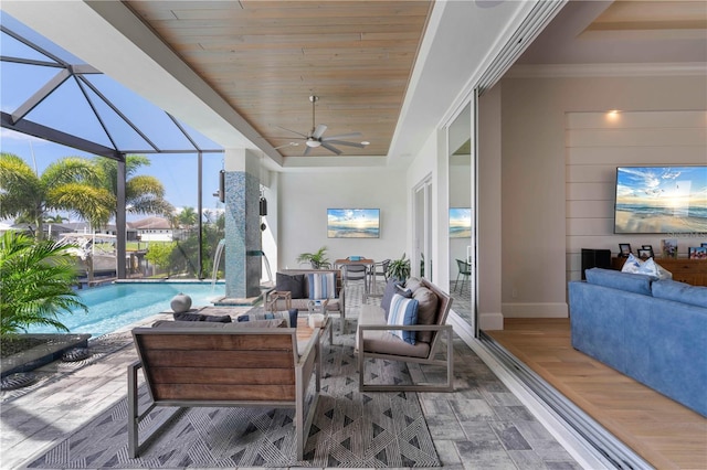 sunroom / solarium featuring a raised ceiling, ceiling fan, and wooden ceiling