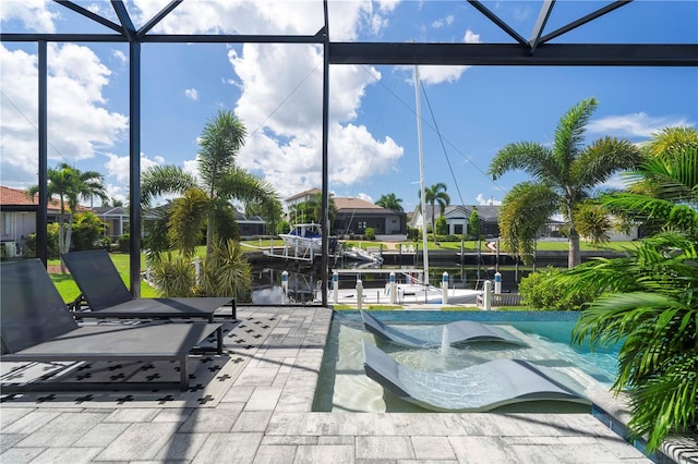 view of patio / terrace with a water view, a pool, and a lanai