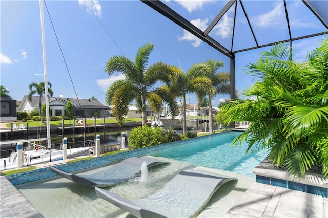 view of swimming pool featuring a water view, a patio, and glass enclosure