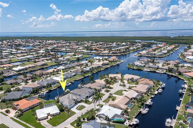 birds eye view of property with a water view