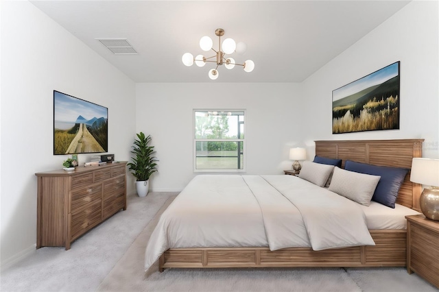 carpeted bedroom with an inviting chandelier