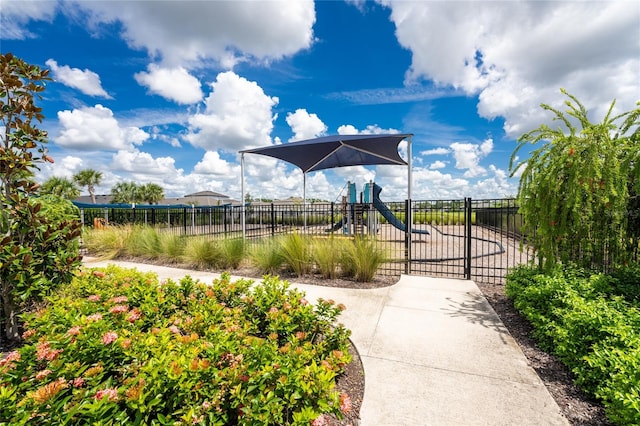 view of property's community with a playground