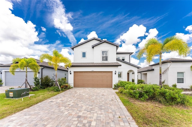 view of front of home featuring a garage and a front yard