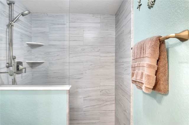 bathroom with a tile shower