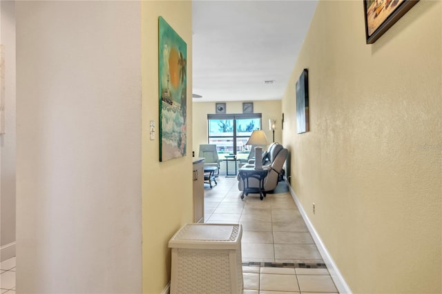 hallway featuring light tile patterned floors