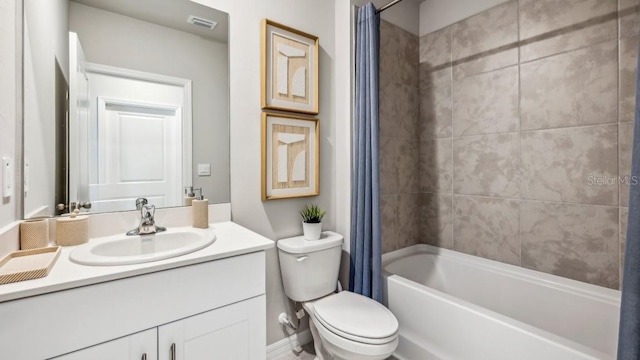 bathroom featuring shower / bath combo with shower curtain, toilet, vanity, and visible vents