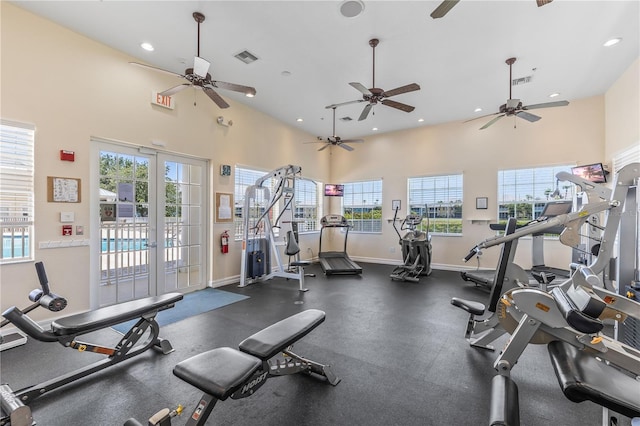 exercise room featuring recessed lighting, french doors, visible vents, and a wealth of natural light