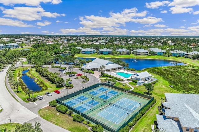 birds eye view of property featuring a residential view and a water view