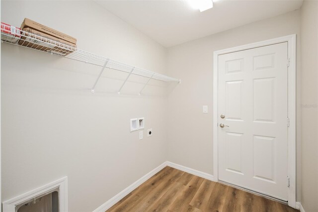 laundry area with hookup for a washing machine, hookup for an electric dryer, and wood-type flooring