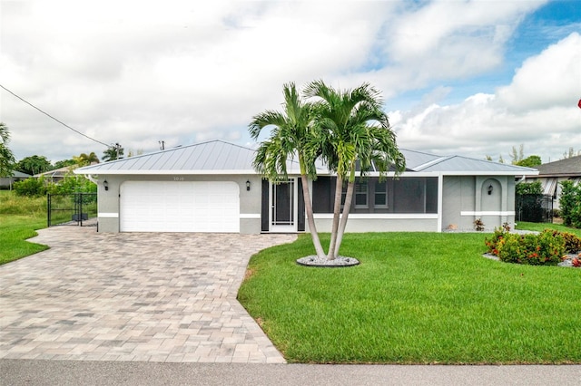 ranch-style house with a garage and a front yard