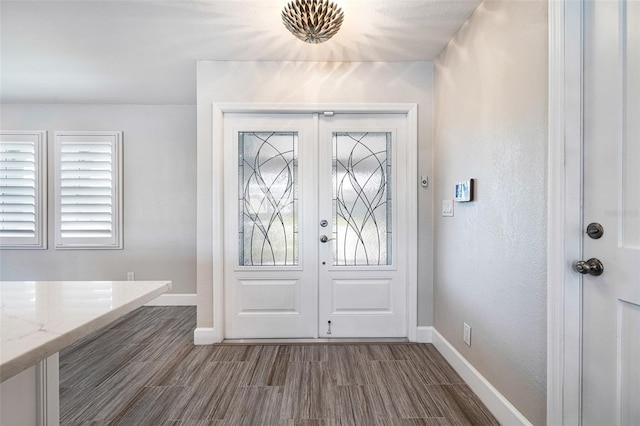 entrance foyer featuring french doors and hardwood / wood-style flooring