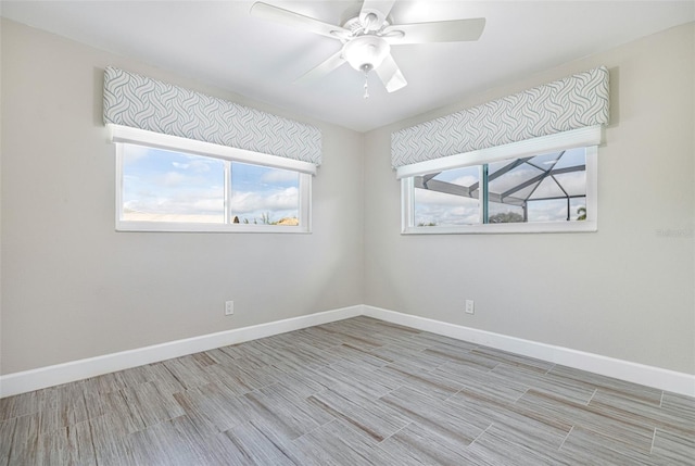 spare room featuring ceiling fan and light hardwood / wood-style floors