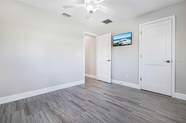 unfurnished bedroom with ceiling fan and light hardwood / wood-style flooring