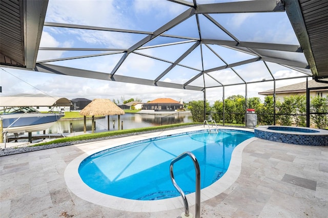 view of pool featuring a water view, a lanai, a patio, and an in ground hot tub