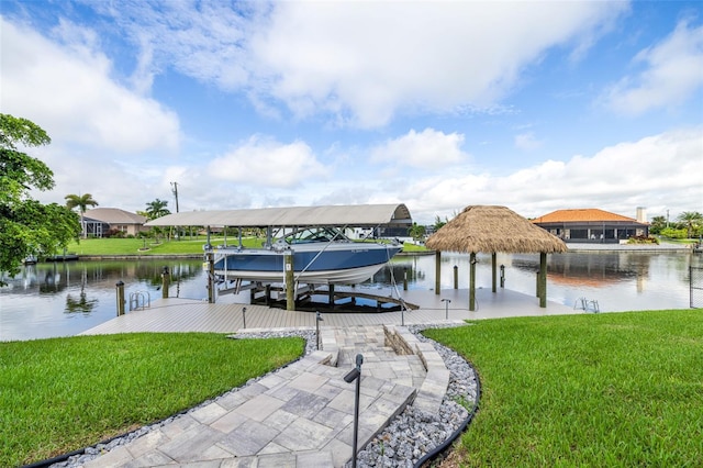 dock area with a water view and a yard