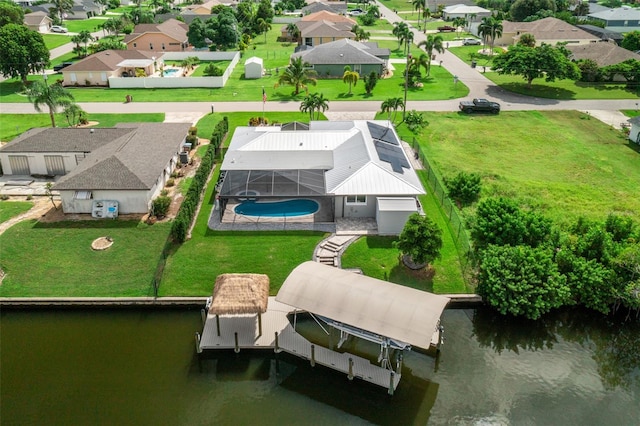 birds eye view of property with a water view