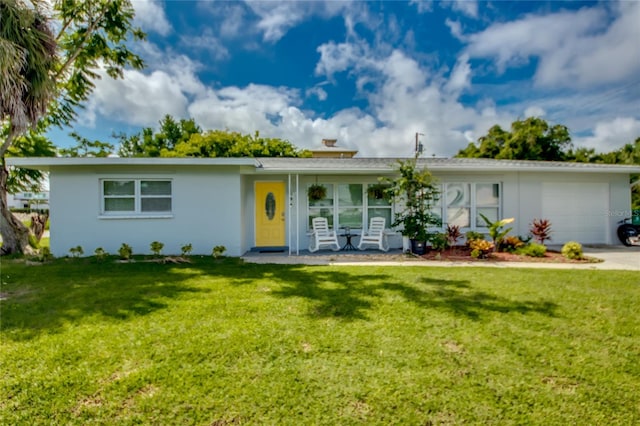 ranch-style house featuring a garage, stucco siding, concrete driveway, and a front yard