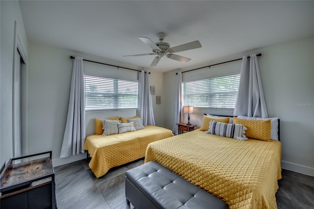 bedroom with multiple windows and ceiling fan