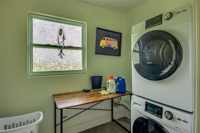 laundry area featuring stacked washer and clothes dryer