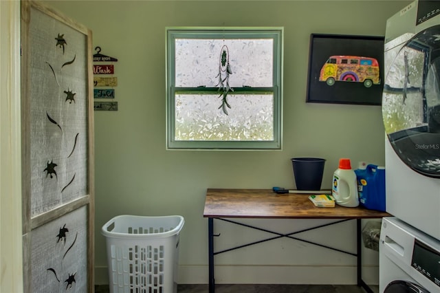 laundry room with stacked washing maching and dryer