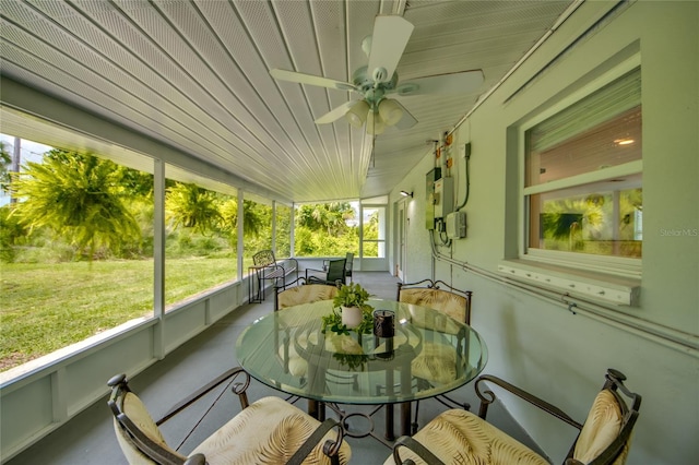 sunroom featuring ceiling fan and a healthy amount of sunlight