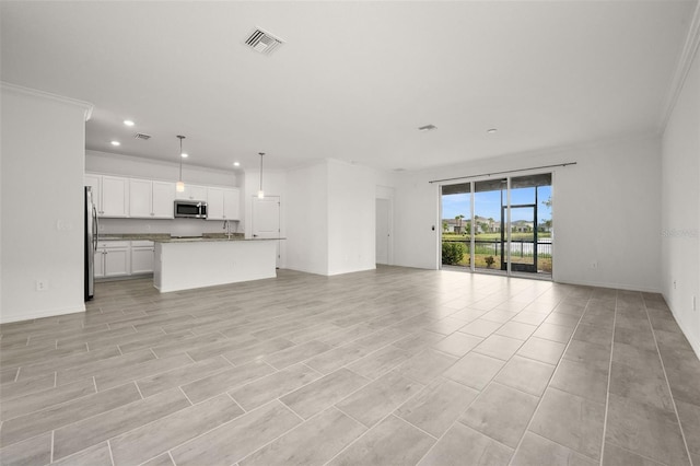 unfurnished living room featuring light hardwood / wood-style floors and ornamental molding