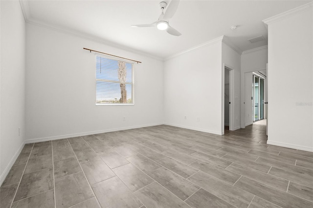 empty room featuring ceiling fan, ornamental molding, and light hardwood / wood-style flooring