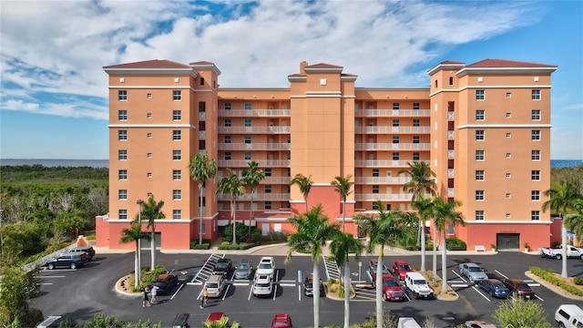 view of property featuring uncovered parking