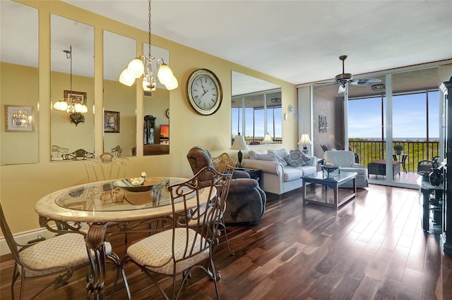 dining area featuring floor to ceiling windows, ceiling fan with notable chandelier, and dark hardwood / wood-style floors