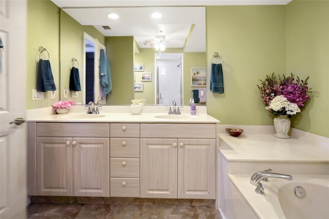 bathroom with vanity and separate shower and tub