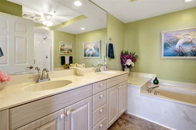 bathroom featuring ceiling fan, shower with separate bathtub, and vanity