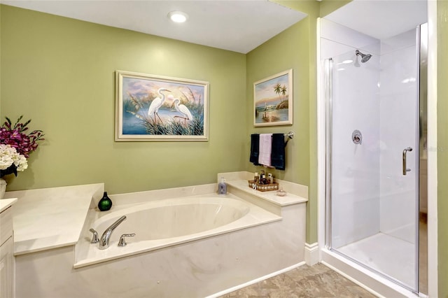 bathroom featuring independent shower and bath and vanity