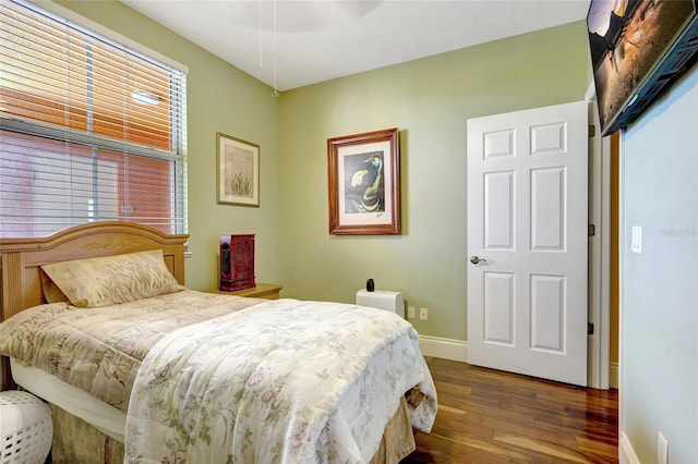 bedroom featuring dark wood-type flooring