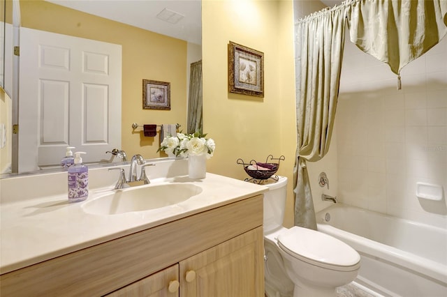 full bathroom with shower / tub combo with curtain, vanity, and toilet