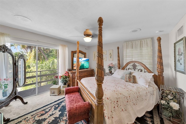 bedroom featuring a textured ceiling, access to exterior, ceiling fan, and carpet floors