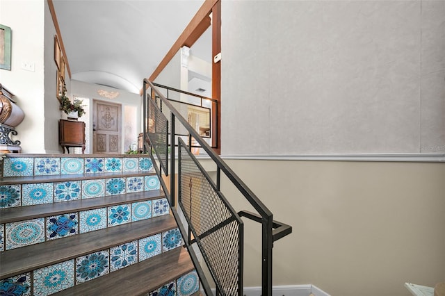 staircase featuring hardwood / wood-style floors