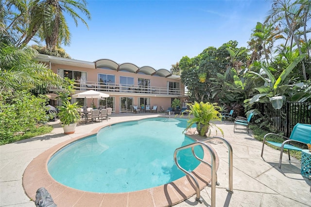 view of pool featuring a patio