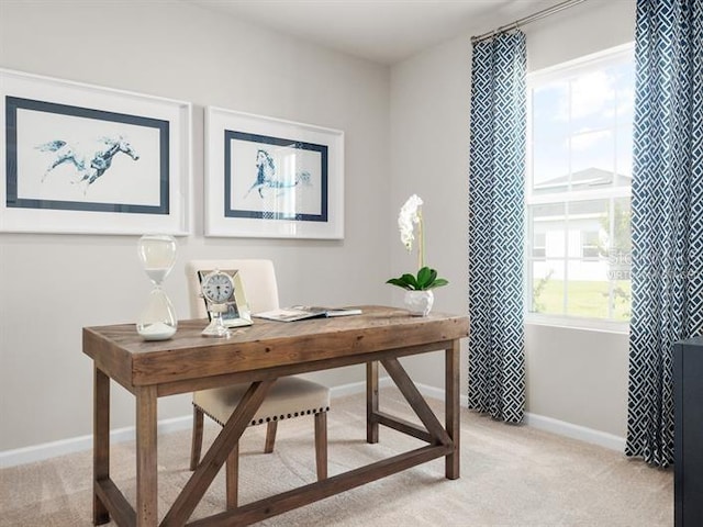 office area featuring light colored carpet