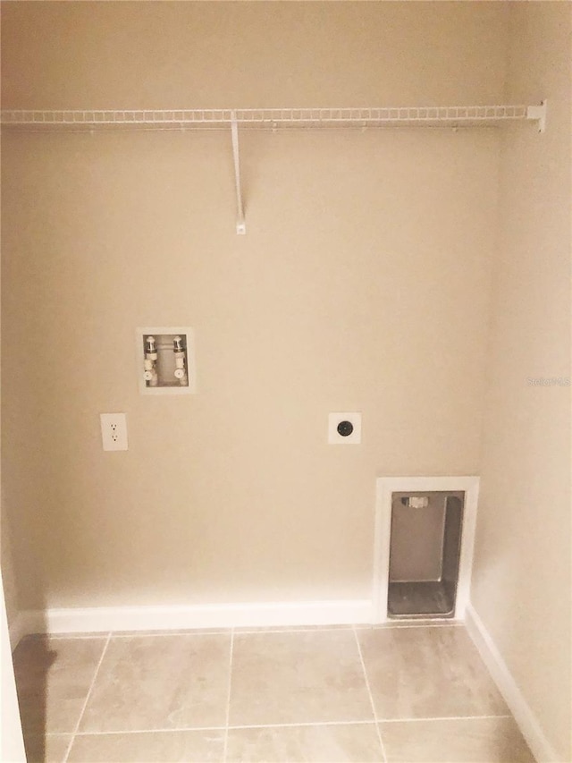 laundry room featuring hookup for a washing machine, hookup for an electric dryer, and tile patterned floors